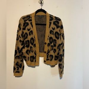 Medium- cropped cheetah sweater/cardigan.